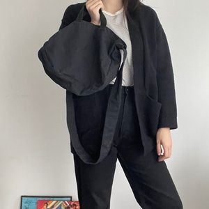 Medium black crossbody bag from MUJI